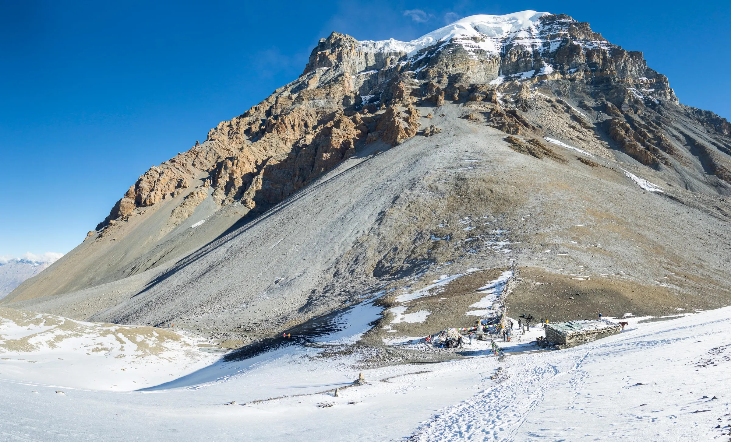 Bare, snow-streaked slopes around the Thorong La pass on the Annapurna Circuit